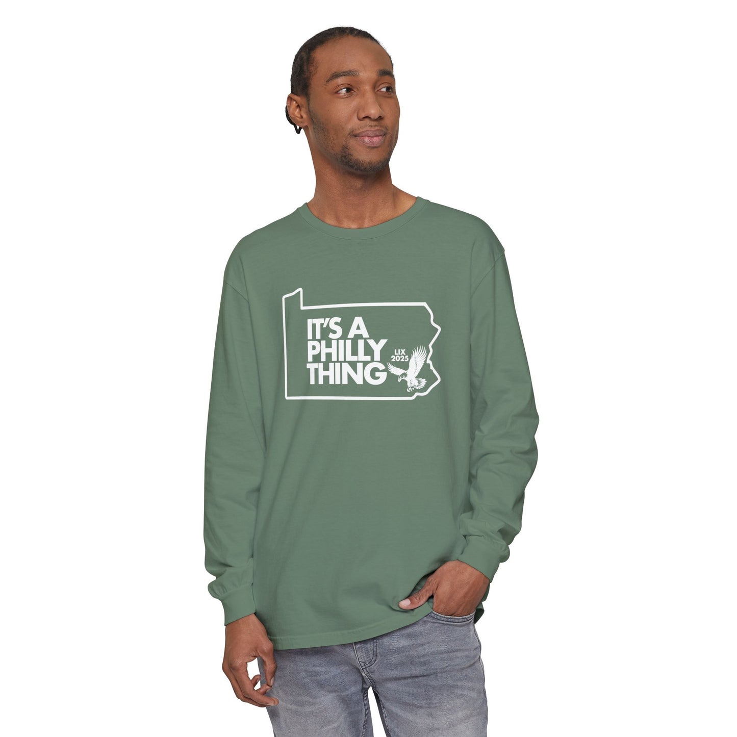 Man wearing a green long-sleeve shirt with a graphic design on a white background