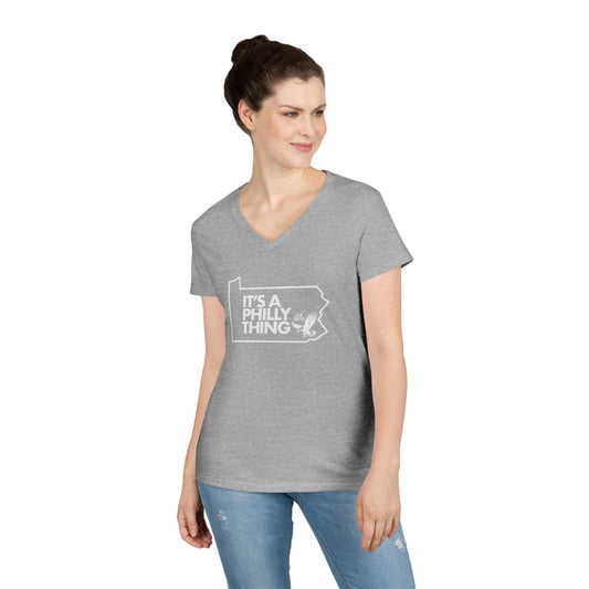 Woman wearing a gray t-shirt with a graphic design on a white background