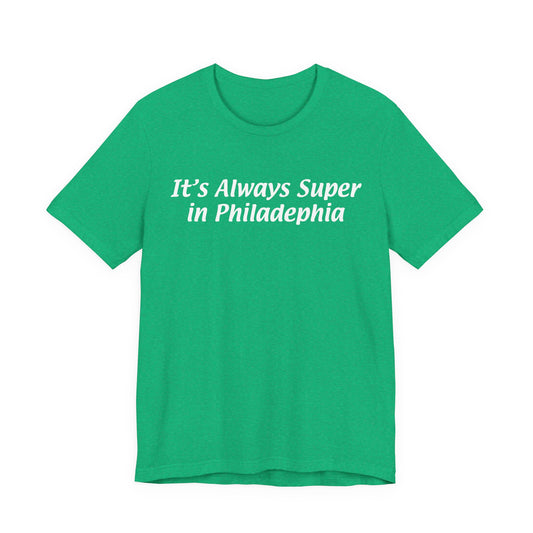 Green t-shirt with white text 'It's Always Super in Philadelphia' on a white background