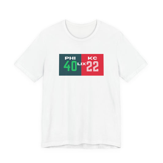 White t-shirt with sports-themed design featuring numbers and letters on a white background